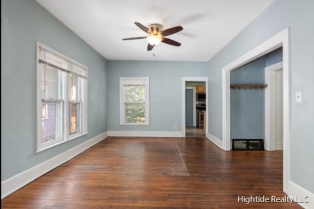 232 Oakley Pl NE, Grand Rapids, MI 49503 - unfurnished room featuring a ceiling fan, wood finished floors, and baseboards