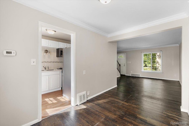 22865 Lakeshore Dr, Saint Clair Shores, MI 48080 - empty room featuring a sink, dark wood-style floors, stairs, ornamental molding, and baseboards