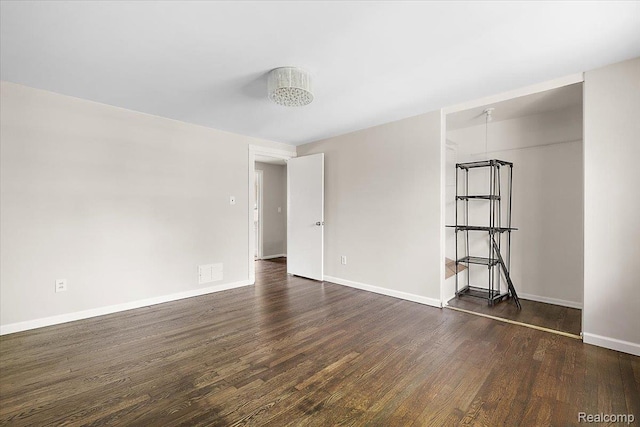 22865 Lakeshore Dr, Saint Clair Shores, MI 48080 - empty room with dark wood-style flooring and baseboards