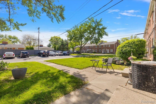 22865 Lakeshore Dr, Saint Clair Shores, MI 48080 - view of grassy yard with central AC unit