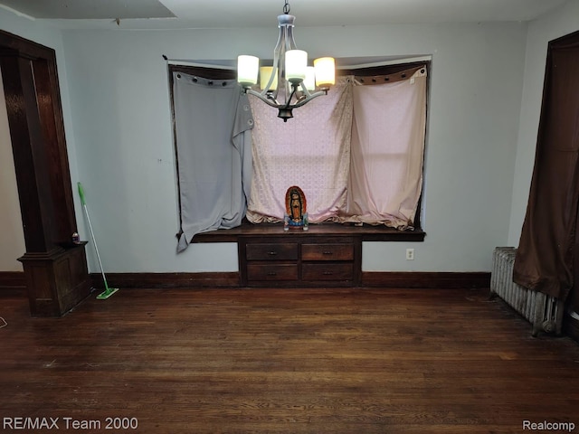 1601 Lawndale St, Highland Park, MI 48209 - unfurnished dining area with radiator heating unit, a chandelier, dark wood-type flooring, and baseboards