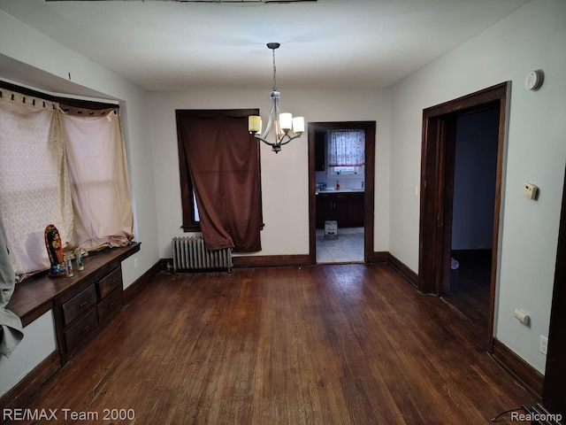 1601 Lawndale St, Highland Park, MI 48209 - unfurnished dining area featuring radiator heating unit, dark wood-style flooring, a chandelier, and baseboards