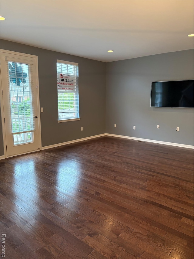56645 Long Island Dr, Shelby Twp, MI 48316 - unfurnished living room with dark wood finished floors, baseboards, and recessed lighting