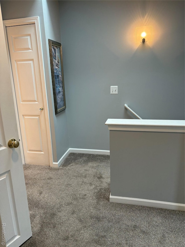 56645 Long Island Dr, Shelby Twp, MI 48316 - hall featuring carpet, baseboards, and an upstairs landing