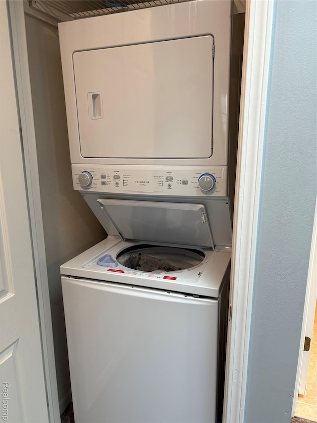 56645 Long Island Dr, Shelby Twp, MI 48316 - laundry area with stacked washer / drying machine