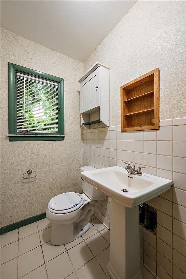 2100 Delhi W, Ann Arbor, MI 48103 - half bathroom featuring toilet, tile walls, and tile patterned flooring