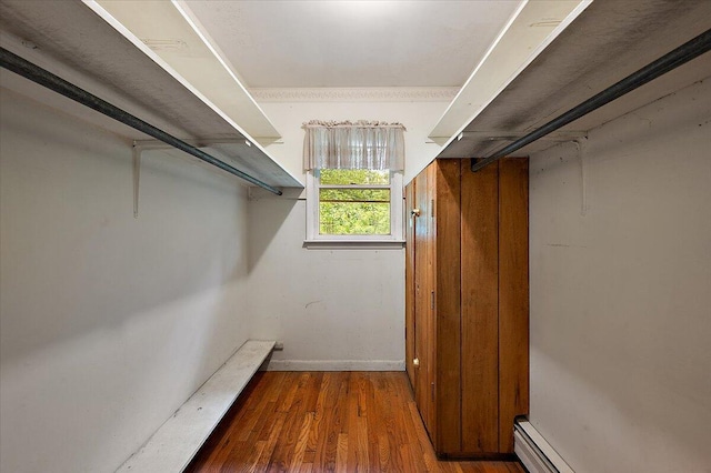 2100 Delhi W, Ann Arbor, MI 48103 - walk in closet featuring wood finished floors and a baseboard heating unit
