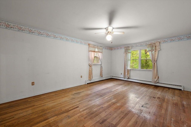 2100 Delhi W, Ann Arbor, MI 48103 - empty room featuring wood finished floors, a ceiling fan, and a baseboard heating unit