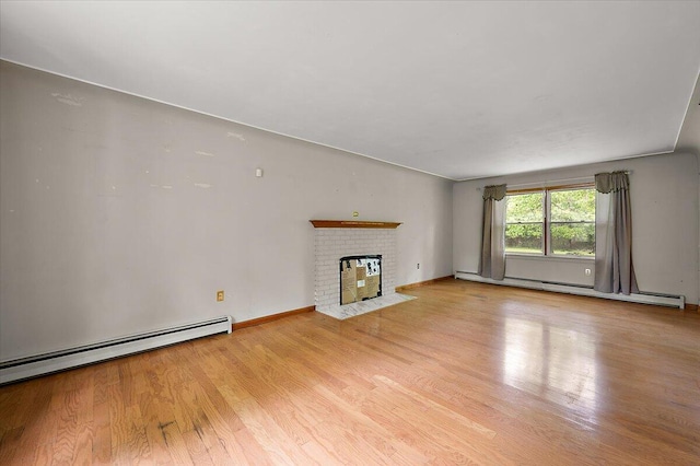 2100 Delhi W, Ann Arbor, MI 48103 - unfurnished living room with a baseboard radiator, wood finished floors, a fireplace, and baseboards