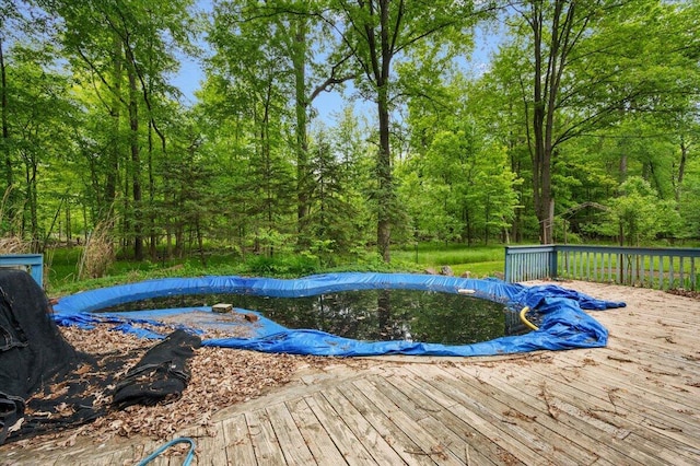 2100 Delhi W, Ann Arbor, MI 48103 - view of swimming pool featuring a wooden deck and a covered pool