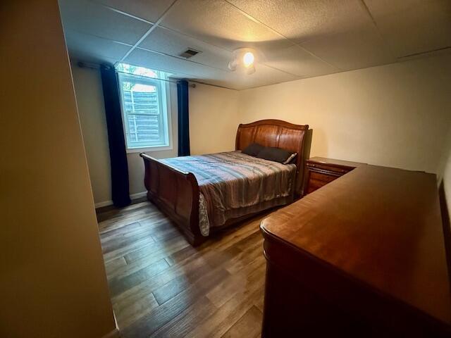 307 W 30th St, Holland, MI 49423 - bedroom with wood finished floors and a drop ceiling