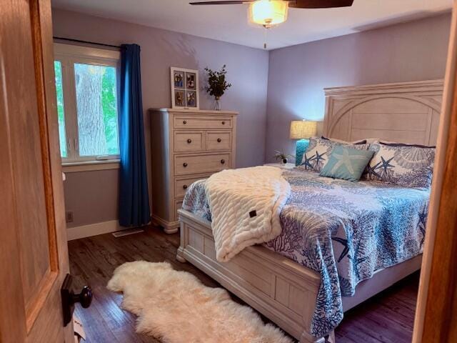 307 W 30th St, Holland, MI 49423 - bedroom featuring wood finished floors, ceiling fan, and baseboards