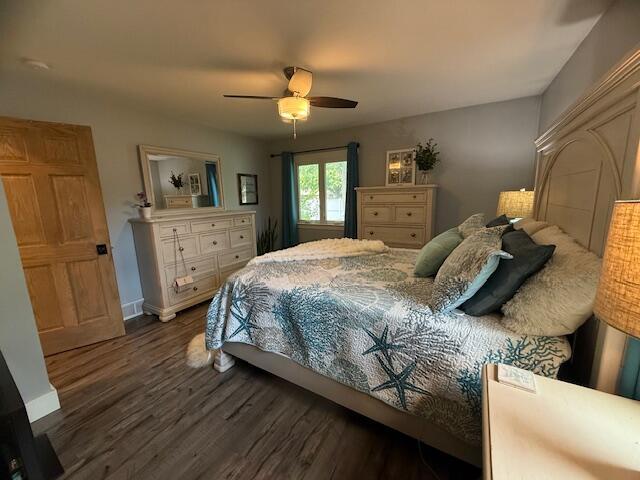 307 W 30th St, Holland, MI 49423 - bedroom featuring dark wood finished floors, baseboards, and a ceiling fan
