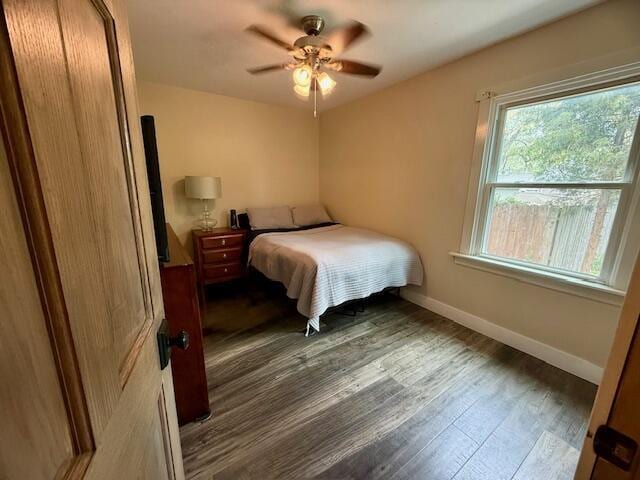 307 W 30th St, Holland, MI 49423 - bedroom featuring wood finished floors, baseboards, and a ceiling fan