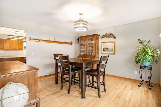 10420 Roger St, Portage, MI 49002 - dining space with light wood-style flooring and baseboards