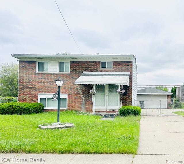 3862 18th St, Ecorse, MI 48229 - view of front of home with brick siding and an outbuilding