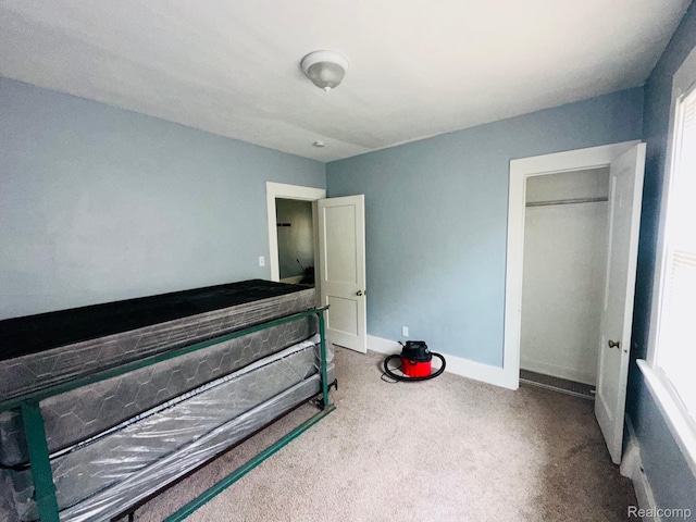 47 W Rockwood St, Ecorse, MI 48229 - unfurnished bedroom featuring carpet floors, baseboards, and multiple windows