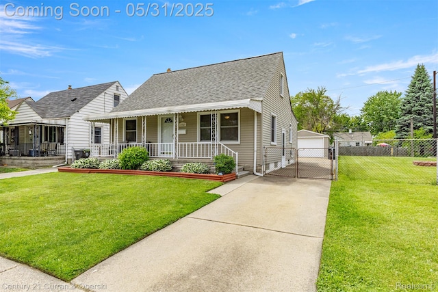17621 Wood St, Melvindale, MI 48122 - view of front of house featuring covered porch, roof with shingles, a garage, and a gate