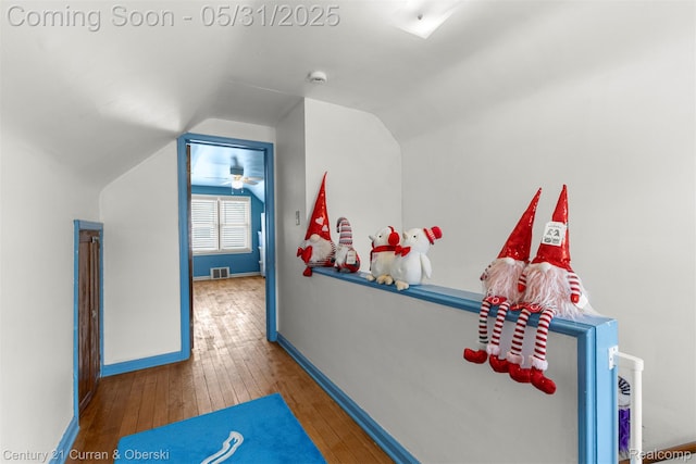 17621 Wood St, Melvindale, MI 48122 - recreation room with hardwood / wood-style floors, lofted ceiling, and baseboards