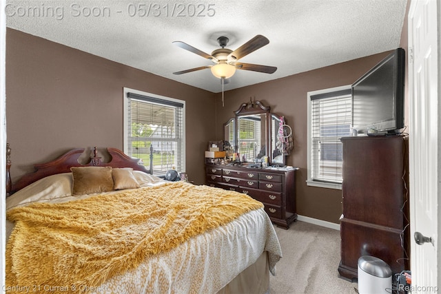 17621 Wood St, Melvindale, MI 48122 - bedroom with light carpet, a textured ceiling, baseboards, and ceiling fan
