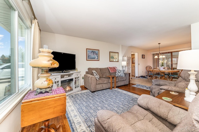 2615 Yosemite St, Saginaw, MI 48603 - living room with wood finished floors and a chandelier