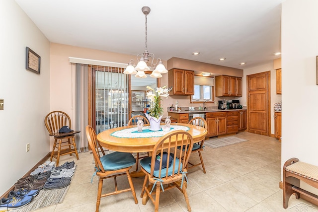 2615 Yosemite St, Saginaw, MI 48603 - dining room with a chandelier, recessed lighting, light tile patterned flooring, and baseboards