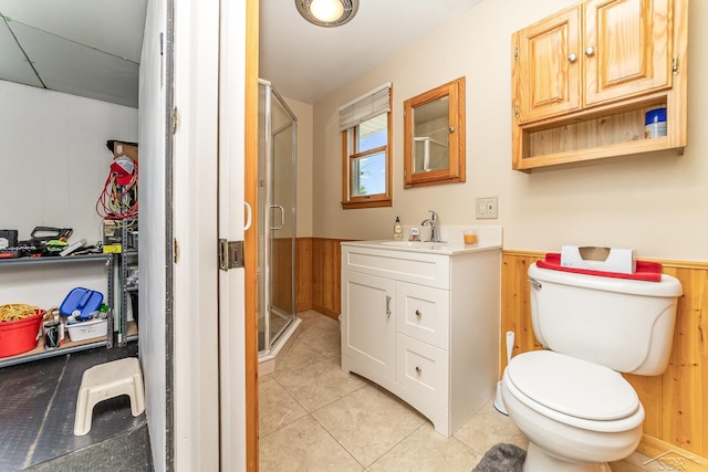 2615 Yosemite St, Saginaw, MI 48603 - full bath with wooden walls, vanity, wainscoting, a stall shower, and tile patterned flooring