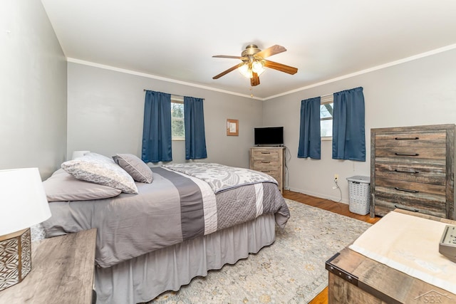 2615 Yosemite St, Saginaw, MI 48603 - bedroom with wood finished floors, crown molding, baseboards, and ceiling fan