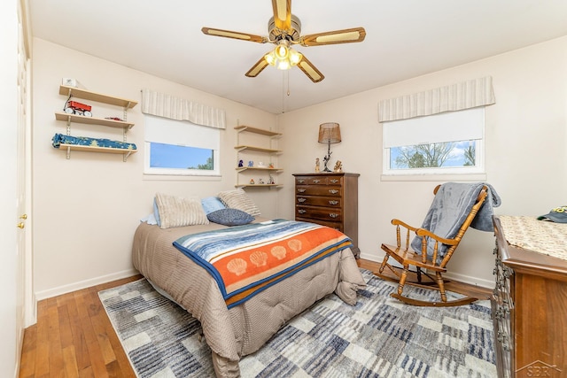 2615 Yosemite St, Saginaw, MI 48603 - bedroom with baseboards, wood finished floors, and a ceiling fan