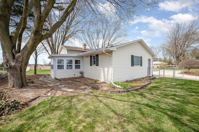 2615 Yosemite St, Saginaw, MI 48603 - rear view of house featuring a chimney