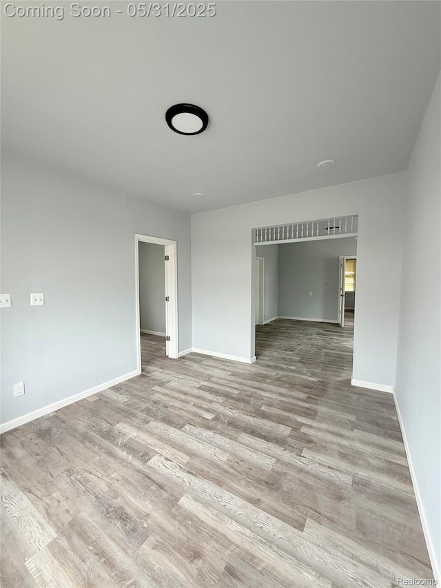 3648 Mack Ave, Hamtramck, MI 48207 - spare room with wood finished floors and baseboards