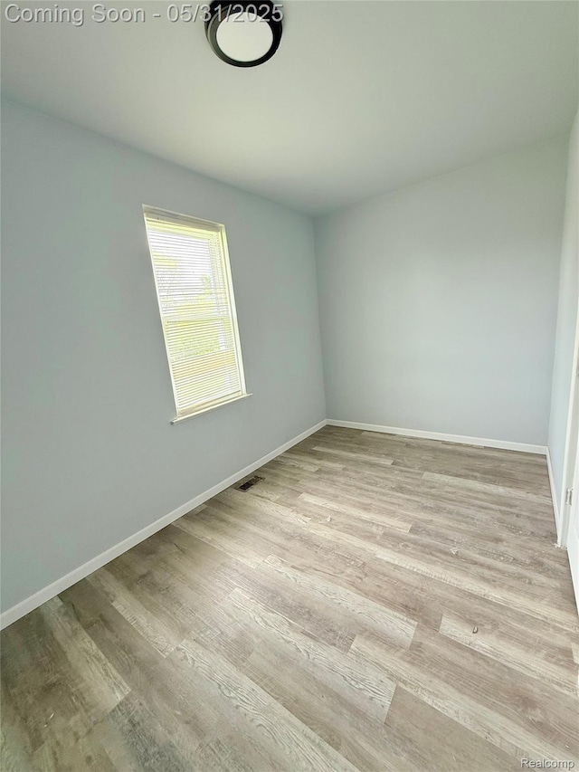 3648 Mack Ave, Hamtramck, MI 48207 - unfurnished room with wood finished floors and baseboards