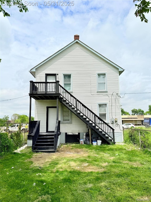 3648 Mack Ave, Hamtramck, MI 48207 - rear view of property with stairway, a chimney, and a deck