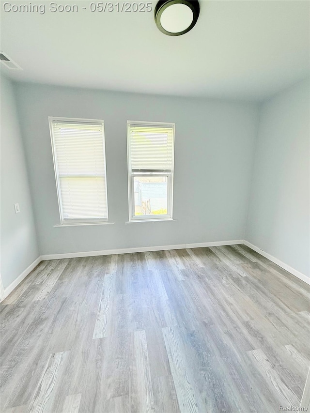 3648 Mack Ave, Hamtramck, MI 48207 - spare room with wood finished floors and baseboards