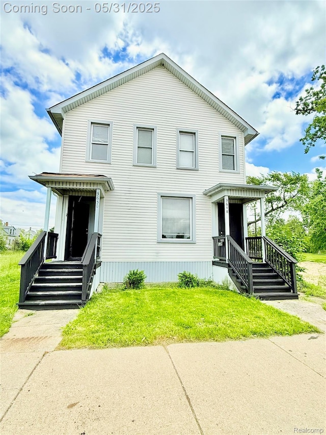 3648 Mack Ave, Hamtramck, MI 48207 - view of front of home featuring a front lawn and a porch