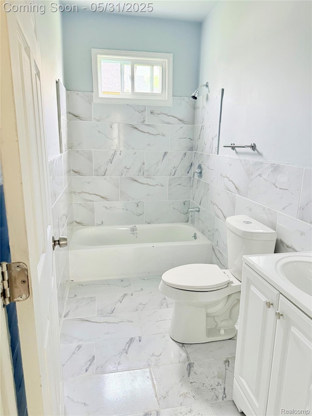 3648 Mack Ave, Hamtramck, MI 48207 - full bath featuring toilet, vanity, tile walls, bathing tub / shower combination, and a wainscoted wall
