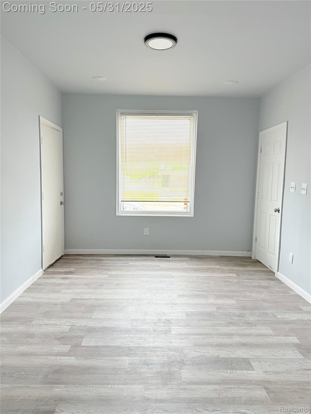 3648 Mack Ave, Hamtramck, MI 48207 - empty room featuring wood finished floors and baseboards