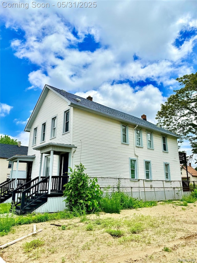 3648 Mack Ave, Hamtramck, MI 48207 - view of side of home with a chimney