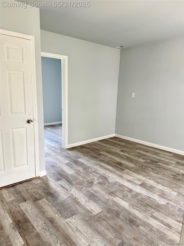 3648 Mack Ave, Hamtramck, MI 48207 - empty room featuring wood finished floors and baseboards