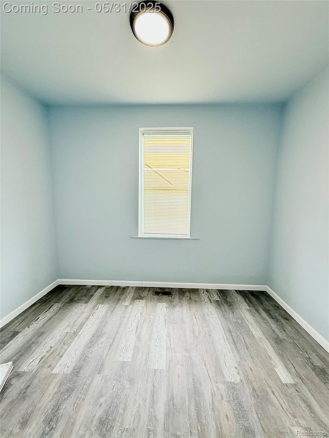 3648 Mack Ave, Hamtramck, MI 48207 - empty room featuring wood finished floors and baseboards