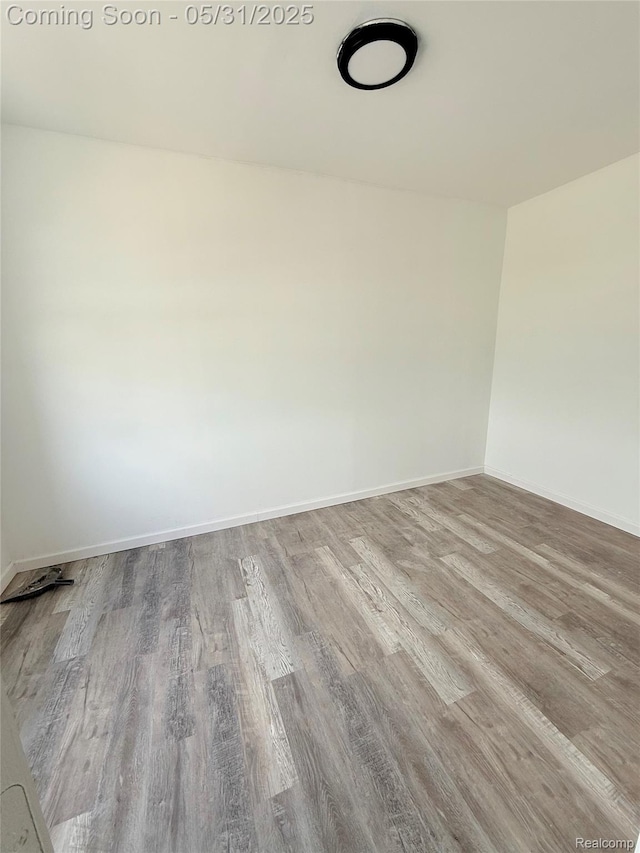 3648 Mack Ave, Hamtramck, MI 48207 - spare room with wood finished floors and baseboards