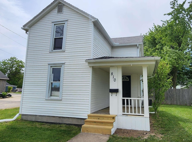 810 Division St, Adrian, MI 49221 - traditional-style home featuring roof with shingles