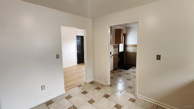 810 Division St, Adrian, MI 49221 - empty room with baseboards and wainscoting