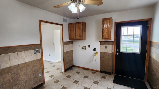 810 Division St, Adrian, MI 49221 - washroom featuring hookup for a washing machine, tile walls, a ceiling fan, and a wainscoted wall