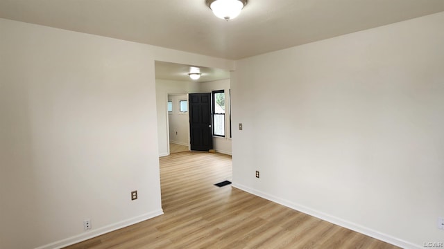 810 Division St, Adrian, MI 49221 - unfurnished room with baseboards and light wood finished floors
