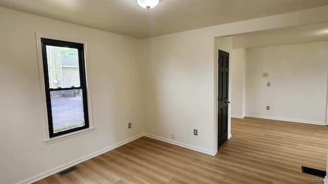 810 Division St, Adrian, MI 49221 - spare room with light wood-style flooring and baseboards