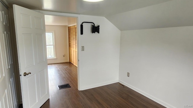 810 Division St, Adrian, MI 49221 - unfurnished room with dark wood finished floors, baseboards, and lofted ceiling