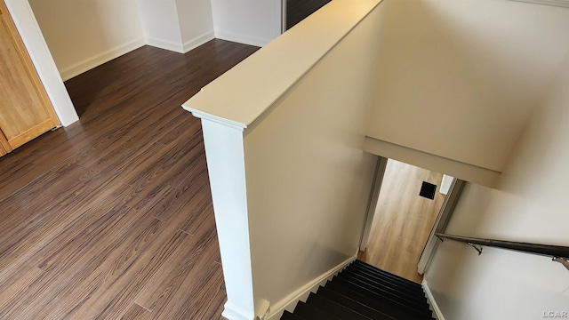 810 Division St, Adrian, MI 49221 - stairs featuring wood finished floors and baseboards