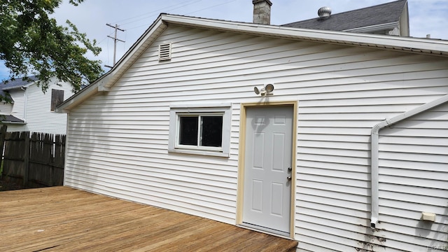 810 Division St, Adrian, MI 49221 - rear view of property featuring a chimney and a deck