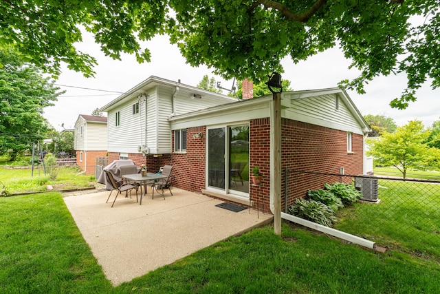3624 Terhune Rd, Ann Arbor, MI 48104 - rear view of property with a patio, central AC unit, brick siding, and a chimney